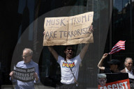 Protesters Demonstrate Outside Elite Law Firm Over Deal With Trump