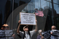 Protesters Demonstrate Outside Elite Law Firm Over Deal With Trump