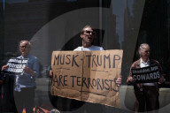 Protesters Demonstrate Outside Elite Law Firm Over Deal With Trump