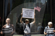 Protesters Demonstrate Outside Elite Law Firm Over Deal With Trump