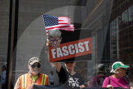 Protesters Demonstrate Outside Elite Law Firm Over Deal With Trump