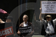 Protesters Demonstrate Outside Elite Law Firm Over Deal With Trump