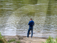 Man Alone By A River