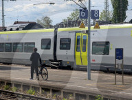 Man With Bicycle At A Train Station In Bavaria