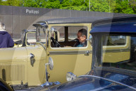 Visitors Admire Classic Cars At The Munich Vintage Car Meeting
