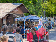 Visitors Enjoy The Auer Dult Fair At Mariahilfplatz In Munich