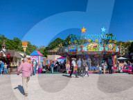 Visitors Enjoy The Auer Dult Fair At Mariahilfplatz In Munich