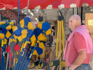 Visitors Enjoy The Auer Dult Fair At Mariahilfplatz In Munich