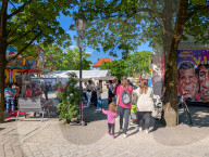 Visitors Enjoy The Auer Dult Fair At Mariahilfplatz In Munich