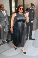 Da'Vine Joy Randolph is seen in a black leather dress outside Live with Kelly & Mark in New York City