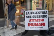 Man Displays Pope Francis Quote Against Inhuman Attacks In Palestine