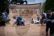 People sign giant U.S. Constitution premable outside White House