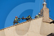  Vatican Firefighters Set The Chimney On The Roof Of The Sistine Chapel