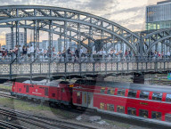 Evening Crowd Sits On Hackerbruecke In Munich