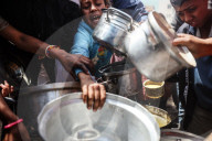 Palestinians Receive Free Food From Food In Gaza City