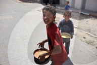 Palestinians Receive Free Food From Food In Gaza City