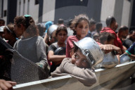 Palestinians Receive Free Food From Food In Gaza City