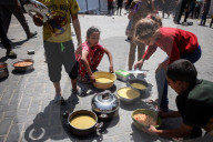 Palestinians Receive Free Food From Food In Gaza City
