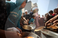 Palestinians Receive Free Food From Food In Gaza City