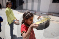 Palestinians Receive Free Food From Food In Gaza City