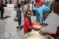 Palestinians Receive Free Food From Food In Gaza City
