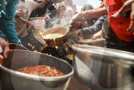 Palestinians Receive Free Food From Food In Gaza City