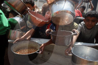 Palestinians Receive Free Food From Food In Gaza City