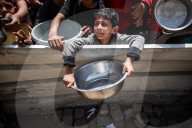 Palestinians Receive Free Food From Food In Gaza City