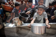 Palestinians Receive Free Food From Food In Gaza City