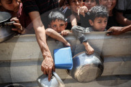 Palestinians Receive Free Food From Food In Gaza City