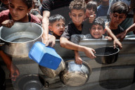 Palestinians Receive Free Food From Food In Gaza City