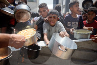 Palestinians Receive Free Food From Food In Gaza City