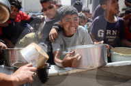 Palestinians Receive Free Food From Food In Gaza City