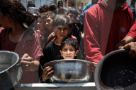 Palestinians Receive Free Food From Food In Gaza City