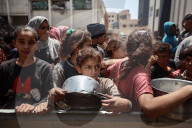 Palestinians Receive Free Food From Food In Gaza City