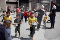 Palestinians Receive Free Food From Food In Gaza City