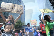 Anti-Tesla And Anti-Elon Musk Protest In Front Of Tesla Showroom At 860 Washington Street