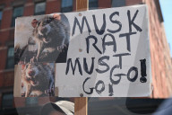 Anti-Tesla And Anti-Elon Musk Protest In Front Of Tesla Showroom At 860 Washington Street