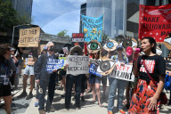 Anti-Tesla And Anti-Elon Musk Protest In Front Of Tesla Showroom At 860 Washington Street