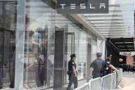 Anti-Tesla And Anti-Elon Musk Protest In Front Of Tesla Showroom At 860 Washington Street