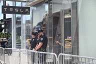 Anti-Tesla And Anti-Elon Musk Protest In Front Of Tesla Showroom At 860 Washington Street