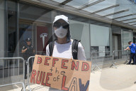 Anti-Tesla And Anti-Elon Musk Protest In Front Of Tesla Showroom At 860 Washington Street