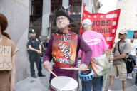 Protesters Rally At Tesla Dealership And March To Billionaires’ Offices In Manhattan