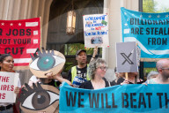 Protesters Rally At Tesla Dealership And March To Billionaires’ Offices In Manhattan