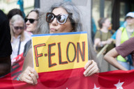 Protesters Rally At Tesla Dealership And March To Billionaires’ Offices In Manhattan