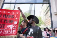 Protesters Rally At Tesla Dealership And March To Billionaires’ Offices In Manhattan