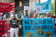 Protesters Rally At Tesla Dealership And March To Billionaires’ Offices In Manhattan