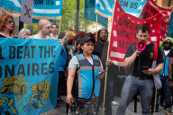 Protesters Rally At Tesla Dealership And March To Billionaires’ Offices In Manhattan