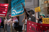 Protesters Rally At Tesla Dealership And March To Billionaires’ Offices In Manhattan