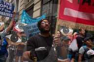 Protesters Rally At Tesla Dealership And March To Billionaires’ Offices In Manhattan